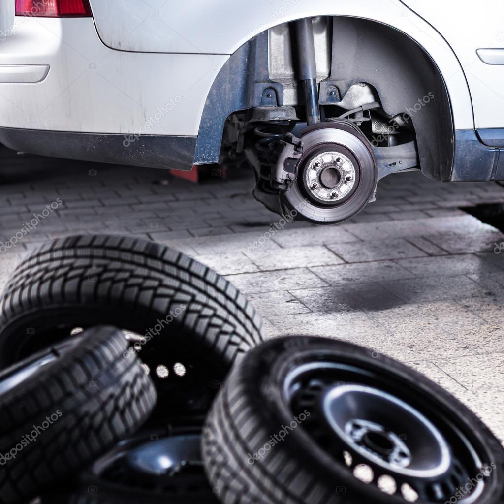 Inside a garage changing wheels or tires — Stock Photo © lightpoet