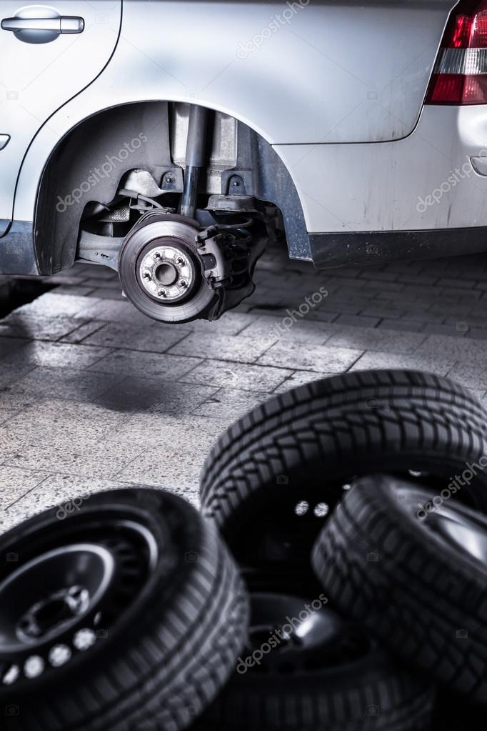 Inside a garage changing wheels or tires — Stock Photo © lightpoet