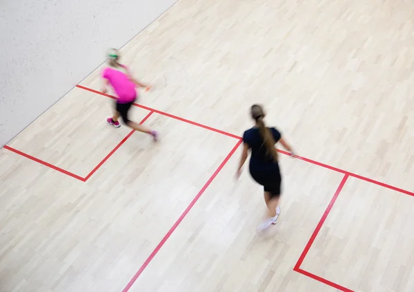 Two female squash players in fast action — Stock Photo, Image