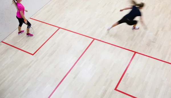 Two female squash players in fast action — Stock Photo, Image