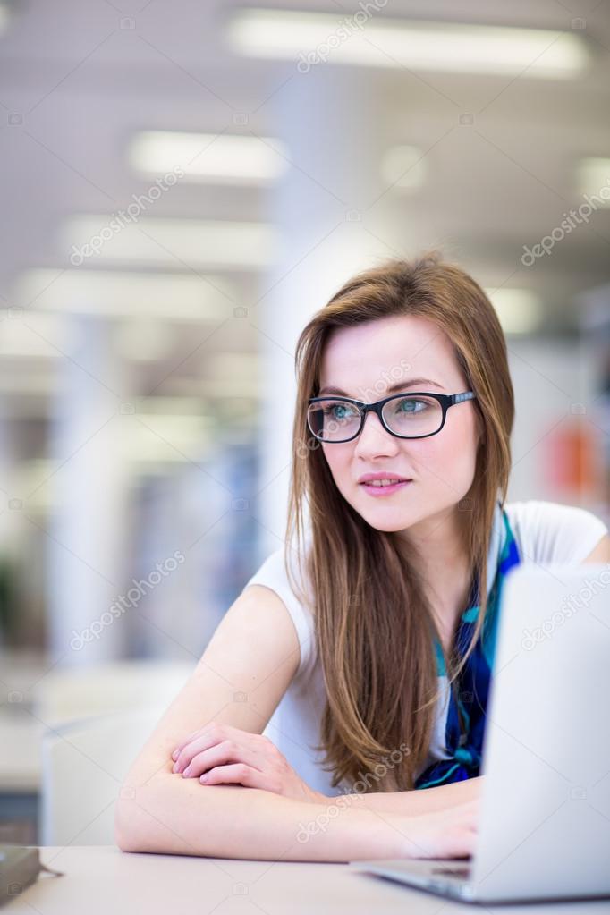 Female college student in a library
