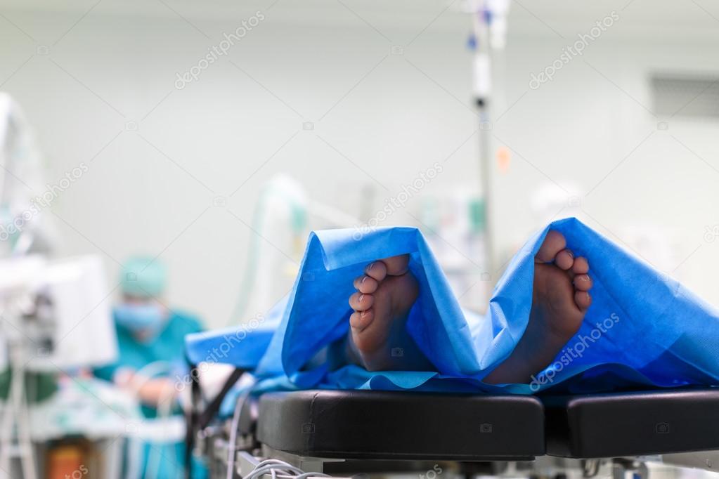 Feet of a patient ready  for a surgery in a surgery room