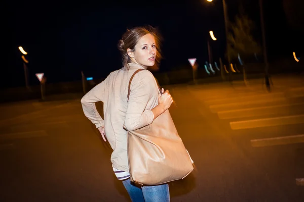 Scared young woman running from her pursuer — Stock Photo, Image