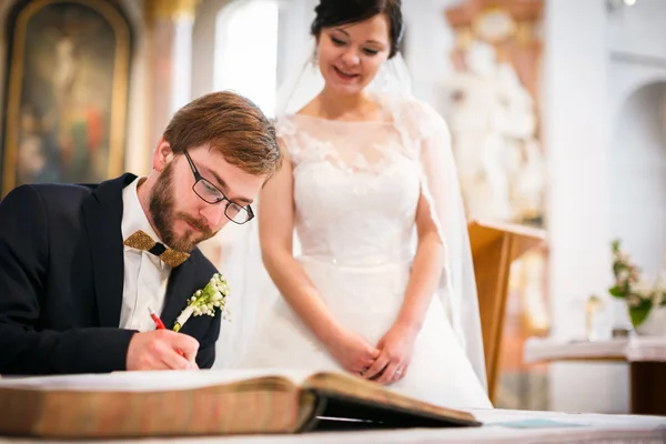 Groom signing the Contract of his life — Stockfoto