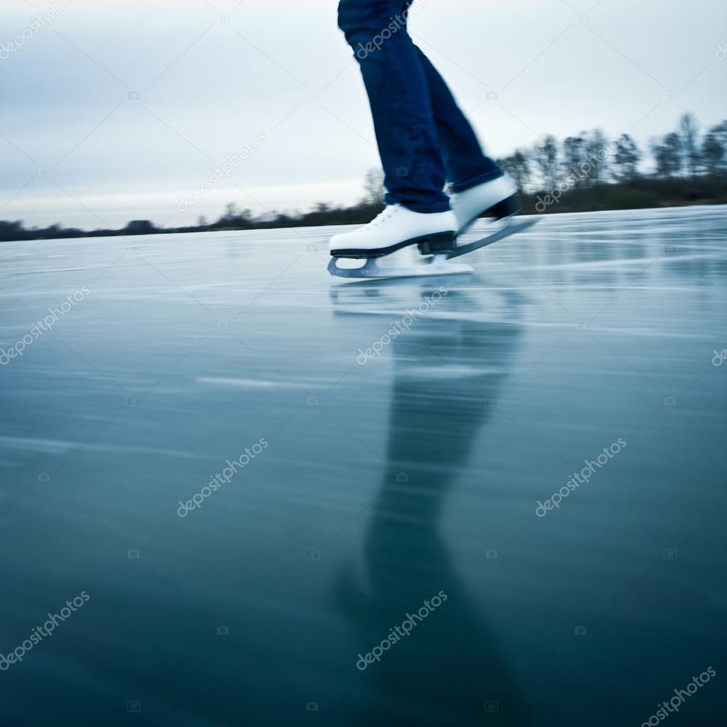 Young woman ice skating outdoors