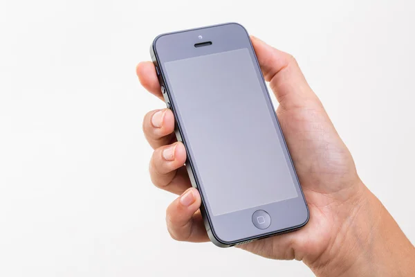 Vrouwelijke hand met een slimme telefoon — Stockfoto