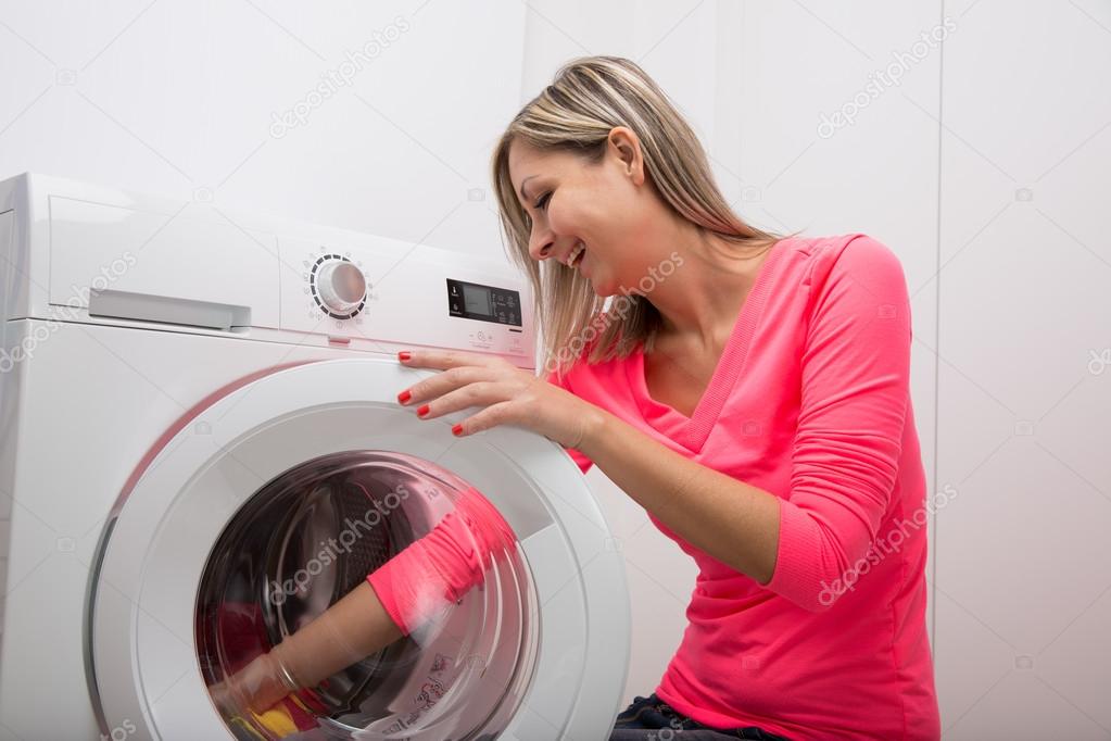 Housework -  young woman doing laundry
