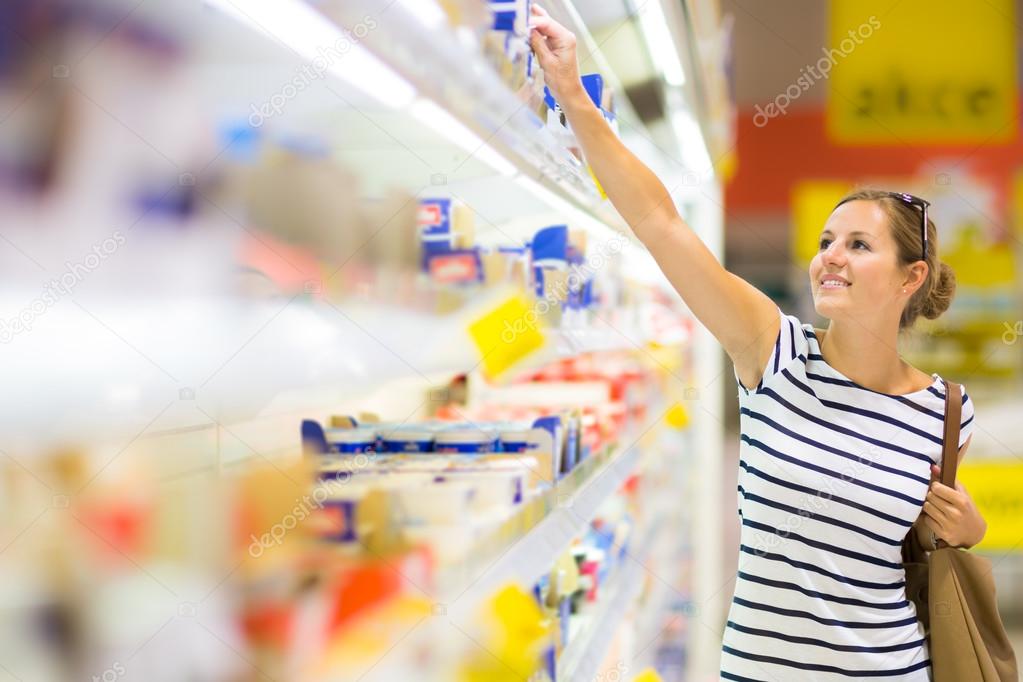 Woman shopping for diary products at a grocery