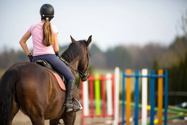 Woman show jumping with horse — Stock Photo, Image