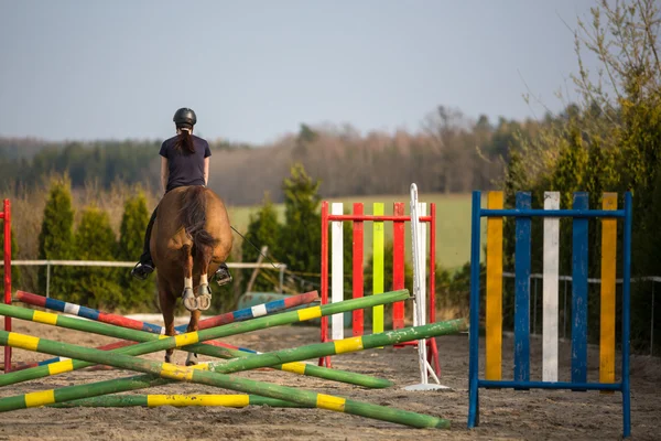 Woman show jumping with horse — Stock Photo, Image