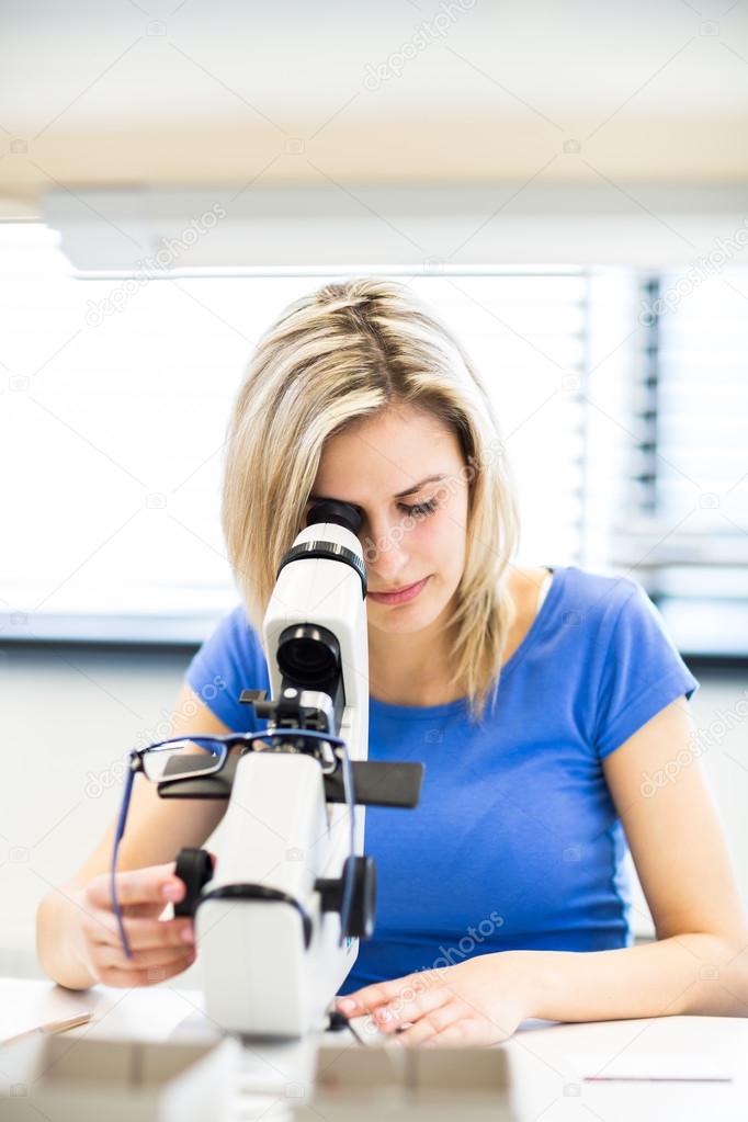 Female optometrist measuring   glasses