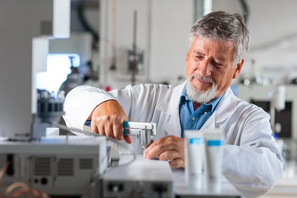 Senior chemistry professor/doctor in a lab (color toned image) — Stock Photo, Image