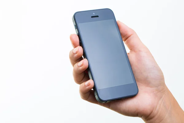 Vrouwelijke hand met een slimme telefoon, geïsoleerd op wit — Stockfoto