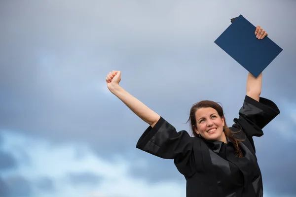 Pretty, young woman celebrating joyfully her graduation — Stock Photo, Image