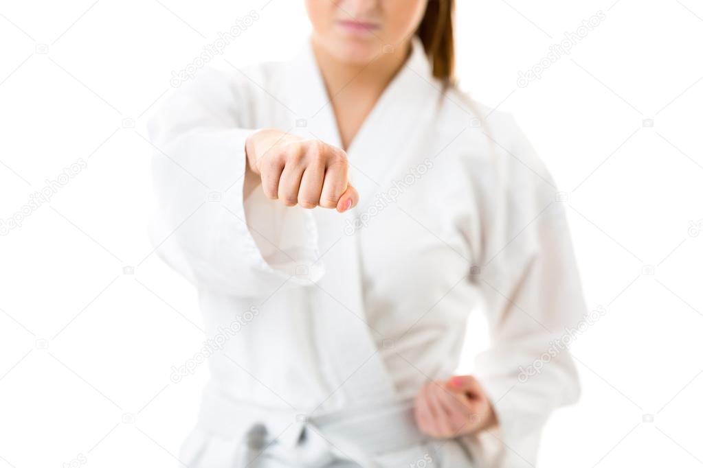 Beautiful caucasian, young, woman performing karate moves