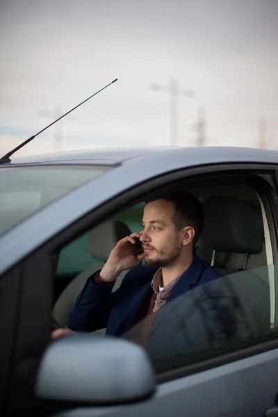 Handsome young man calling on his cellphone — Stock Photo, Image