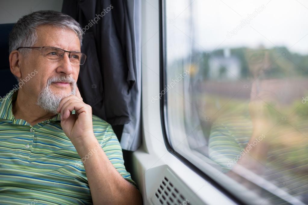 Senior man enjoying a train travel