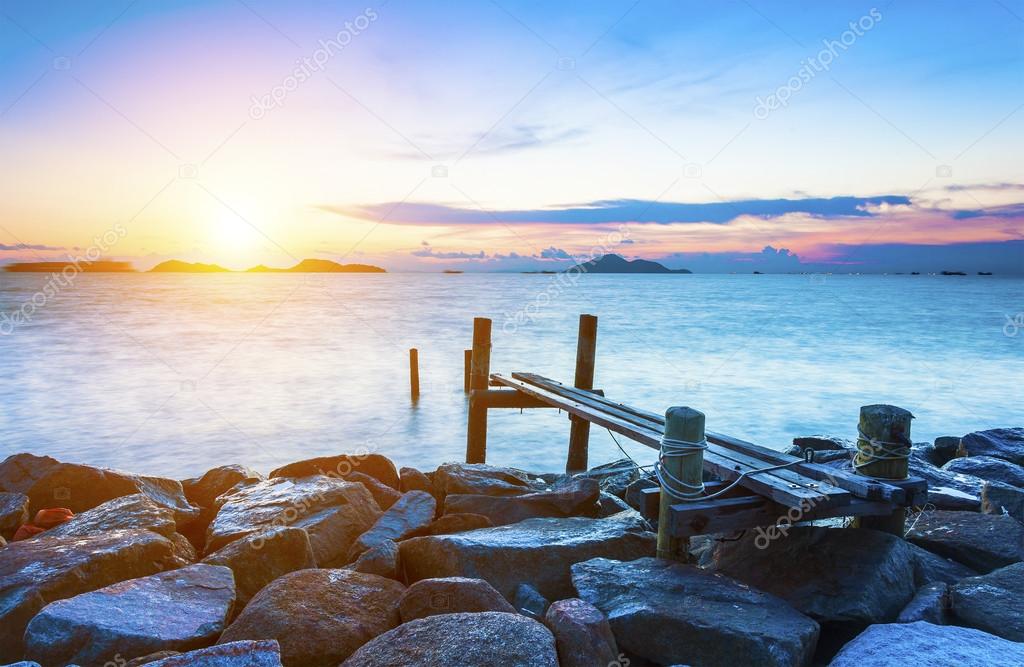 Pier over sunset waters