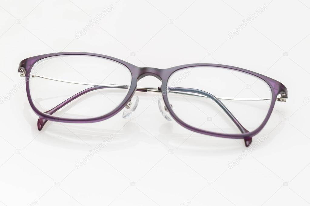 Purple glasses on white background
