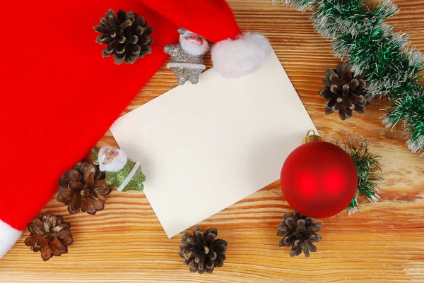 Tarjeta de Navidad en un tablero de madera —  Fotos de Stock