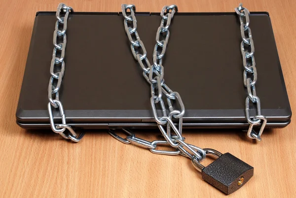 Laptop in the chain — Stock Photo, Image