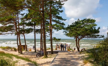 PALANGA,LITHUANIA-AUGUST 23, 2019:Public beach under cloudy sky, Palanga,Lithuania,Europe