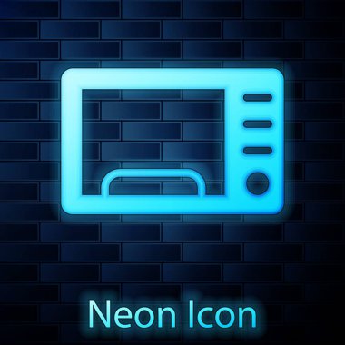 Parlayan neon mikrodalga fırın ikonu tuğla duvar arka planında izole edilmiş. Ev aletleri simgesi. Vektör.