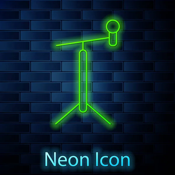Gloeiende Neon Lijn Microfoon Met Standaard Pictogram Geïsoleerd Bakstenen Muur — Stockvector