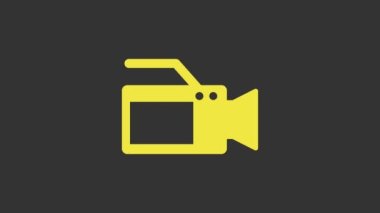 Sarı Sinema kamera simgesi gri arkaplanda izole edildi. Video kamera. Film tabelası. Film projektörü. 4K Video hareketli grafik canlandırması