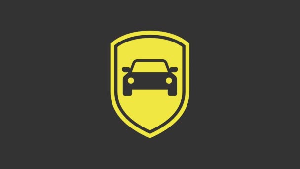Icône jaune de protection de voiture ou d'assurance isolée sur fond gris. Protégez le bouclier de protection. Badge de sécurité véhicule icône. Étiquette automatique de sécurité. Animation graphique de mouvement vidéo 4K — Video