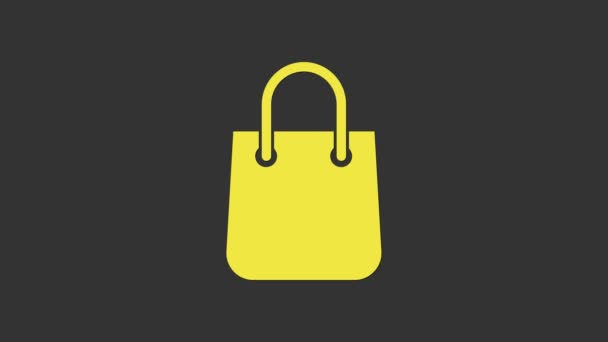 Icono de la bolsa de compras amarilla aislado sobre fondo gris. Firma del paquete. Animación gráfica de vídeo 4K — Vídeo de stock