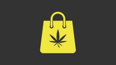 Sarı alışveriş poşeti, gri arka planda izole edilmiş tıbbi marihuana veya kenevir yaprağı ikonu. Kenevir almak. Kenevir sembolü. 4K Video hareketli grafik canlandırması