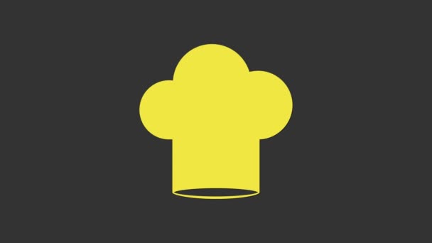 Жовта піктограма капелюха шеф-кухаря ізольована на сірому фоні. Символ приготування. Кухарський капелюх. 4K Відео рух графічна анімація — стокове відео