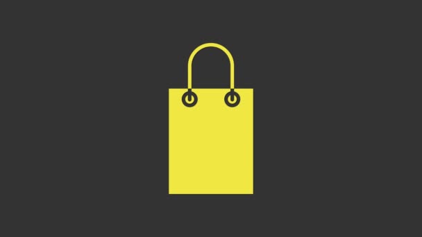 Icono de bolsa de papel amarillo aislado sobre fondo gris. Firma del paquete. Animación gráfica de vídeo 4K — Vídeo de stock