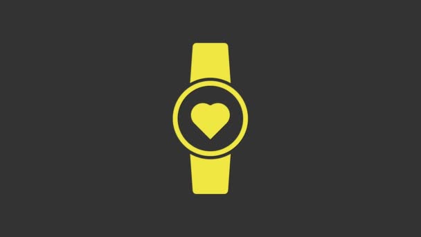 Yellow Smart watch showing heart beat rate icon isolated on grey background. Fitness App concept. 4K Video motion graphic animation — Stock Video