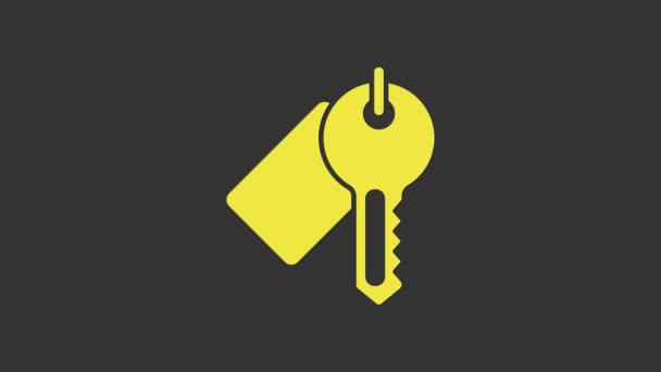 Желтый Значок ключа выделен на сером фоне. Видеографическая анимация 4K — стоковое видео