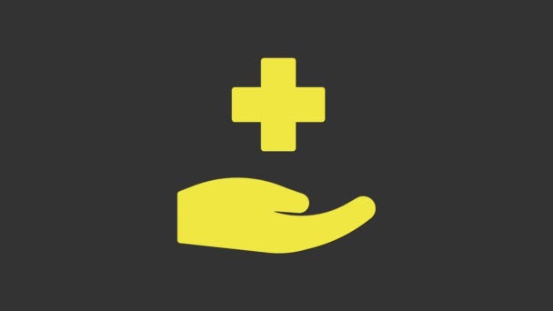 Lékařská ikona nemocnice Yellow Cross izolovaná na šedém pozadí. První pomoc. Diagnostický symbol. Značka medicíny a farmacie. Grafická animace pohybu videa 4K — Stock video