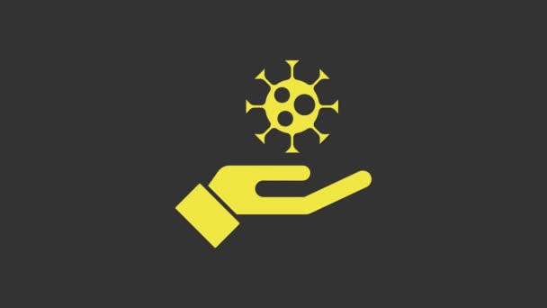 Mano gialla con icona del virus isolata su sfondo grigio. Virus Corona 2019-nCoV. Batteri e germi, cancro alle cellule, microbi, funghi. Animazione grafica 4K Video motion — Video Stock