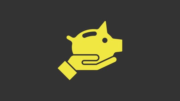 Żółta ikona banku Piggy odizolowana na szarym tle. Ikona oszczędzania lub akumulacji pieniędzy, inwestycji. 4K Animacja graficzna ruchu wideo — Wideo stockowe
