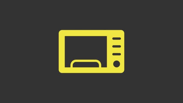 Желтая иконка микроволновой печи изолирована на сером фоне. Значок бытовой техники. Видеографическая анимация 4K — стоковое видео