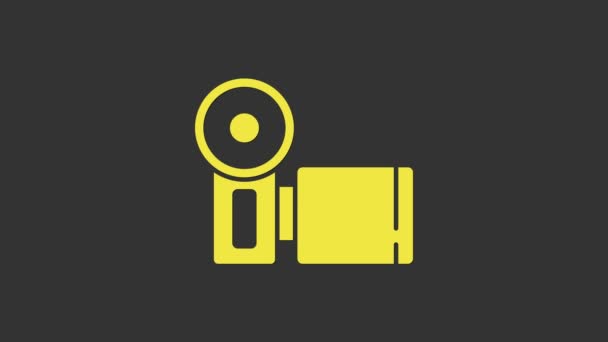 Ikona žluté kamery Cinema izolované na šedém pozadí. Videokamera. Filmová značka. Filmový projektor. Grafická animace pohybu videa 4K — Stock video