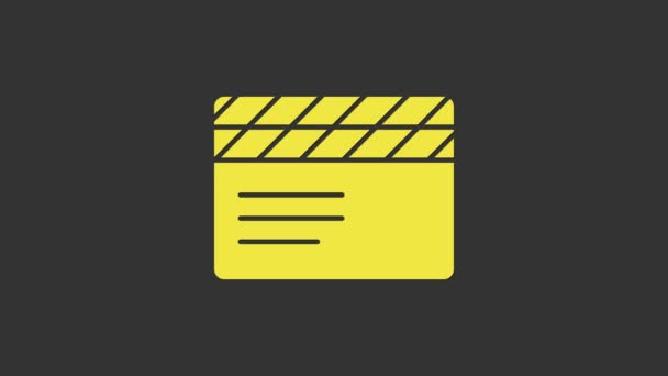 グレーの背景に隔離された黄色のムービークラッパーアイコン。フィルムクラッパーボード。クラッパーボードのサインだ。映画制作やメディア業界。4Kビデオモーショングラフィックアニメーション — ストック動画