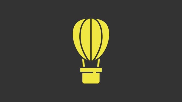 灰色の背景に隔離された黄色の熱気球のアイコン。旅行のための航空輸送。4Kビデオモーショングラフィックアニメーション — ストック動画