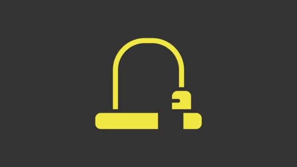 Žlutý zámek jízdních kol U ve tvaru průmyslové ikony izolované na šedém pozadí. Grafická animace pohybu videa 4K — Stock video