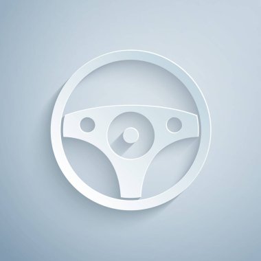 Kağıt kesiği direksiyon simgesi gri arka planda izole edilmiş. Araba tekeri ikonu. Kağıt sanatı tarzı. Vektör