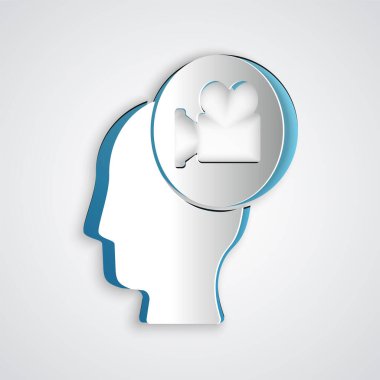 Gri arkaplanda kamera simgesi olan kağıt kesiği kafa. Video kamera. Film tabelası. Film projektörü. Kağıt sanatı tarzı. Vektör.