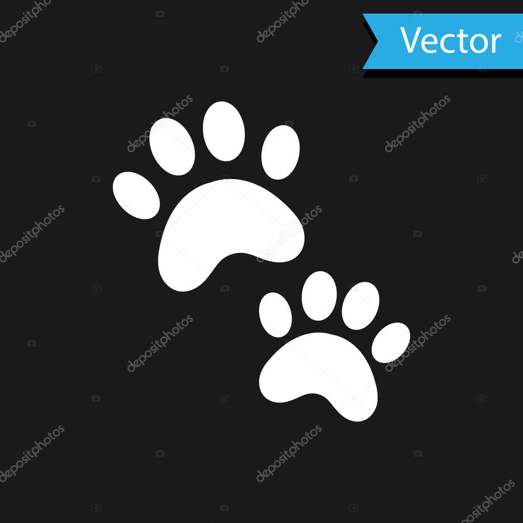 White Paw print icon isolated on black background. Dog or cat paw print. Animal track.  Vector.