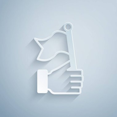 Kağıt kesiği El, gri arka planda bayrak simgesini tutuyor. Zafer, kazanmak ve zorluk konseptini fethetmek. Kağıt sanatı tarzı. Vektör