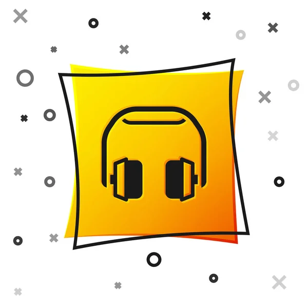 Icono de auriculares negros aislado sobre fondo blanco. Auriculares. Concepto para escuchar música, servicio, comunicación y operador. Botón cuadrado amarillo. Vector — Vector de stock