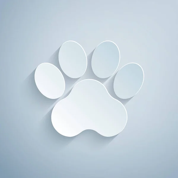 Papel corte ícone de impressão Paw isolado no fundo cinza. Impressão de pata de cão ou gato. Pista animal. Estilo de arte de papel. Vetor — Vetor de Stock